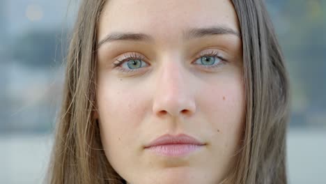 Close-up-view,-portrait-of-woman-with-blue-eyes-looking-into-camera