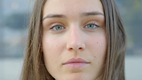 close up view, portrait of woman with blue eyes looking into camera