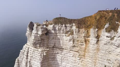 white cliffs of france with hikers