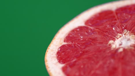 with slices of ripe grapefruit dripping a drop of juice.