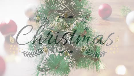 Animation-of-christmas-greetings-text-over-christmas-tree-and-decorations