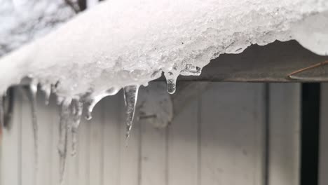 melting ice on the roof of a house