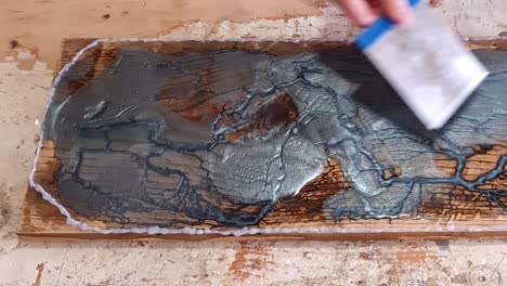 making epoxy art with oak wood and blue pigment