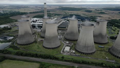 ratcliffe-on-soar power station aerial view orbiting steaming funnel cooling towers in nottingham