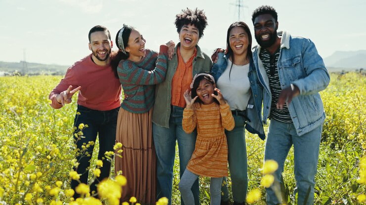 Face, travel and friends in a field
