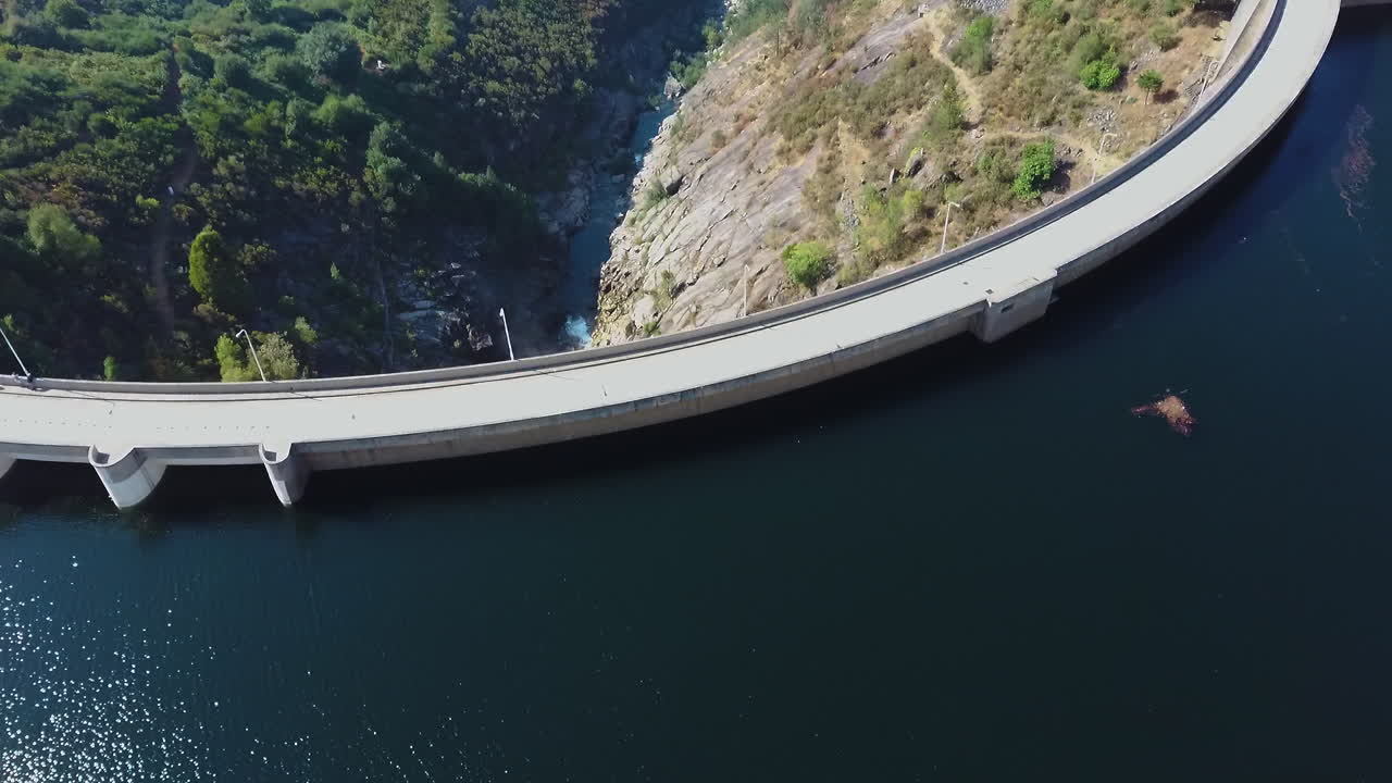 water flow in Dam located in Montalegre, Portugal - Drone shot aerial view forward