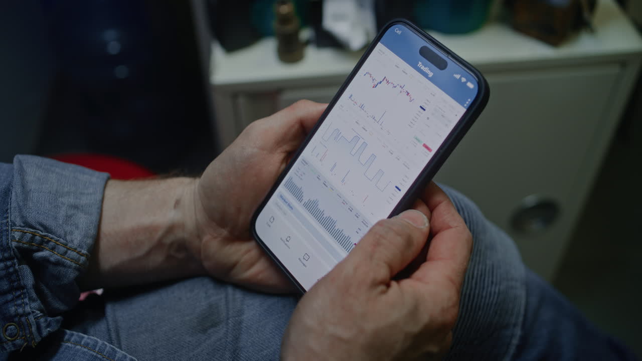 Worker Monitoring Real-Time Stocks, Exchange Market Charts Using Tablet Computer and Laptop. Man Making Cryptocurrency Investments During Working Day in Workshop, Combining Job with Online Trading.