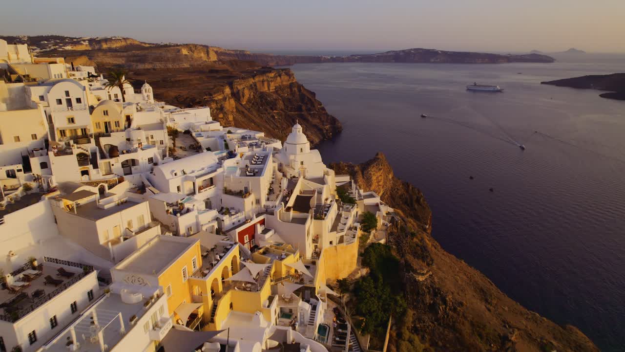 Panoramic Sunset View of Santorini's Iconic White Villages and Caldera