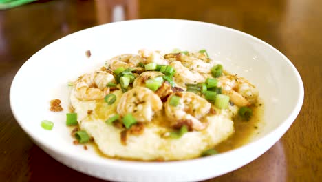 a plate of shrimp and grits steaming fresh and ready to eat