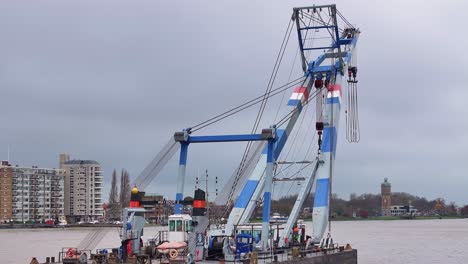 towering steel structure looms over the water as it moves purposefully