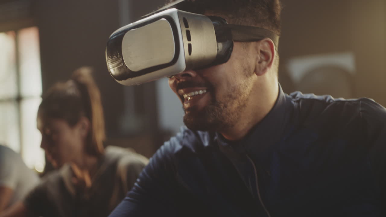 Man Experiencing Virtual Reality Headset in Office Setting