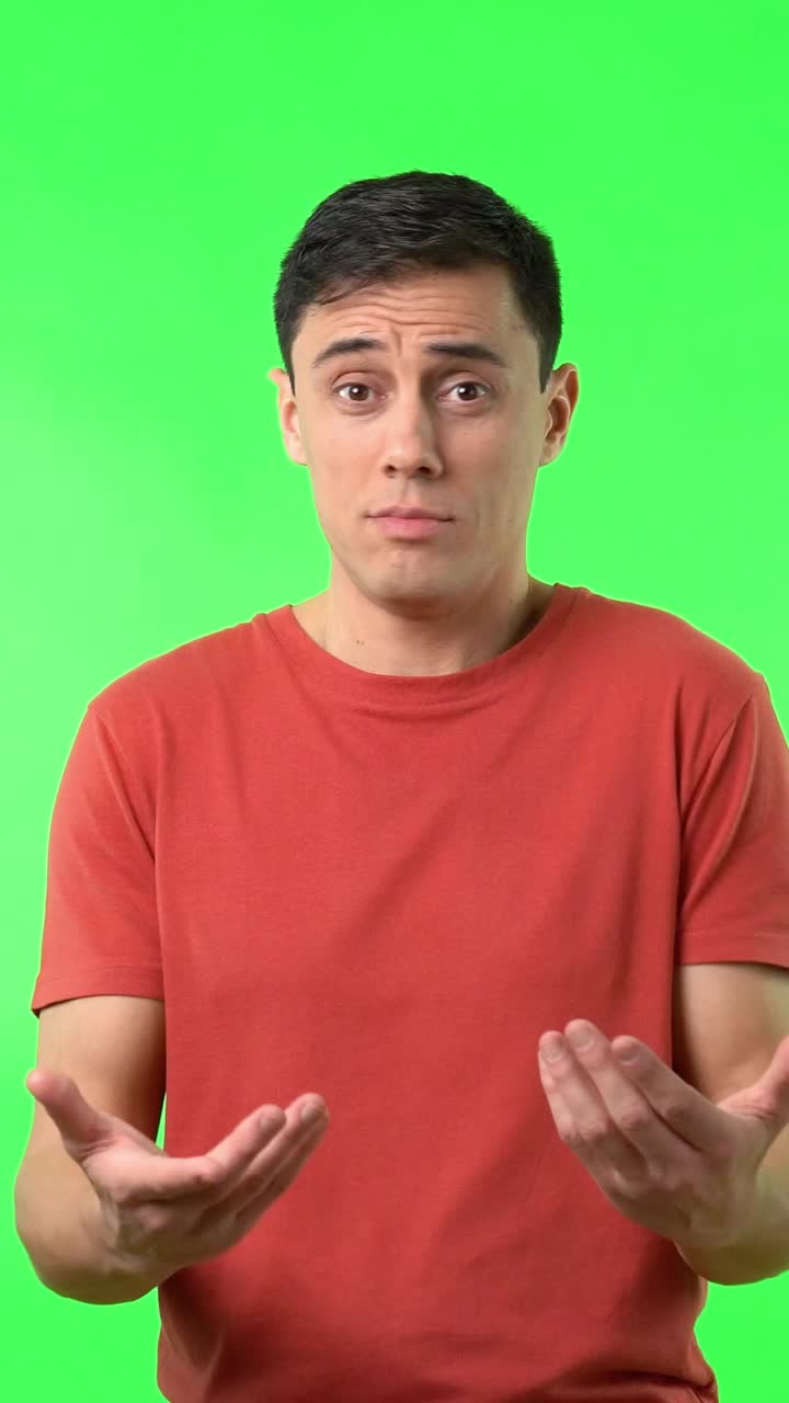 Man in red shirt on green screen