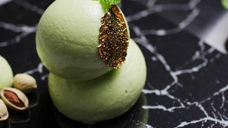 elegant pistachio desserts on black marble