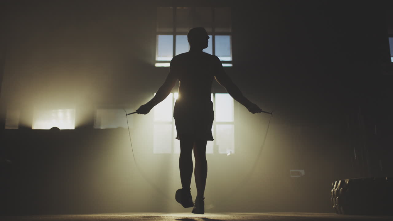 Man Jumping Rope in a Gym