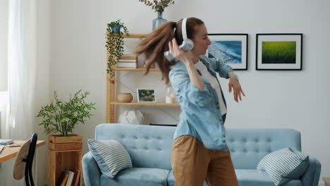 woman dancing and singing at home