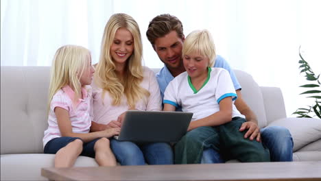 Family-using-laptop-together