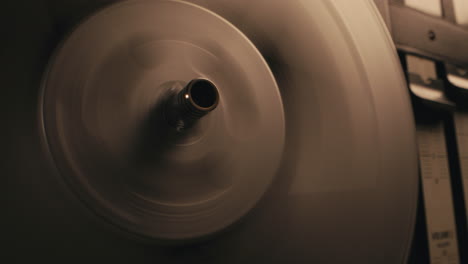 A vintage tape recorder in a pulsing light