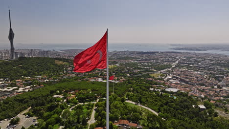 istanbul turkey aerial v80 panoramic view drone fly around waving national flag at camlica hill capturing downtown cityscape, bosphorus strait and famous landmarks - shot with mavic 3 cine - july 2022