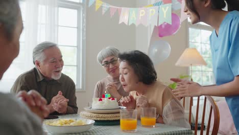 birthday party at senior daycare,group of asian female elder male female laugh smile positive conversation greeting in birthday friend party at nursing home senior daycare center senior woman birthday
