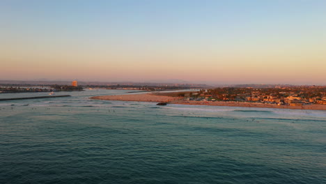 ocean beach dog beach in san diego california at sunset, aerial with copy space