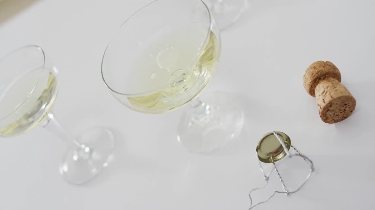 Champagne glasses on white background at new year's eve