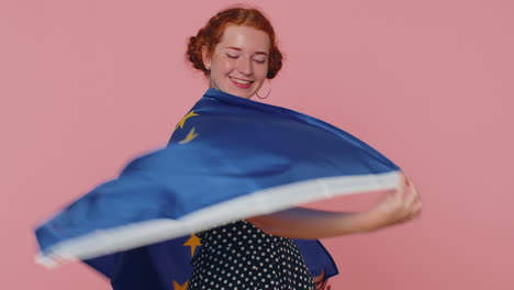 woman in polkadot dress waving european union flag, smiling, cheering democratic laws, human rights