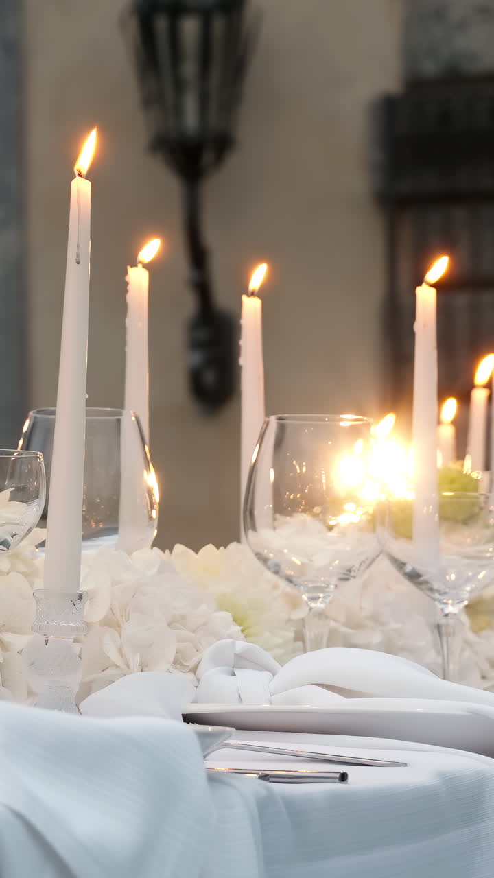 Elegant Table Setting with Candles and Flowers