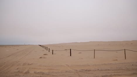 A-conservation-area-with-desert-dunes-in-the-Namib-desert-next-to-a-busy-road-between-Swakopmund-and-Walvisbay-in-Namibia
