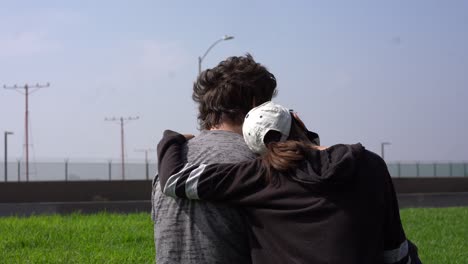 family-watching-airplanes-land-in-park