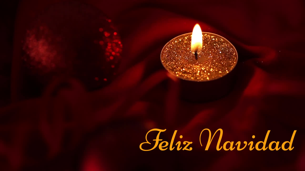 animación de feliz navidad texto sobre vela