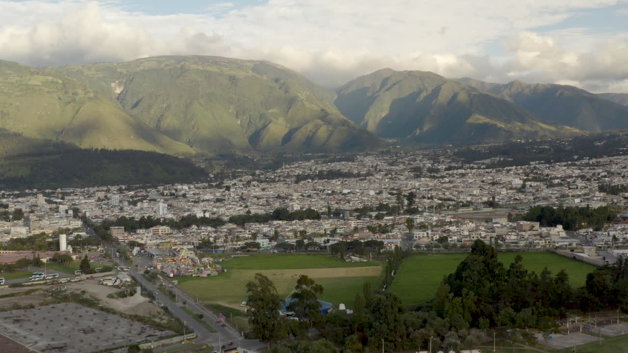 Aerial View of a City Nestled in a Mountain Valley