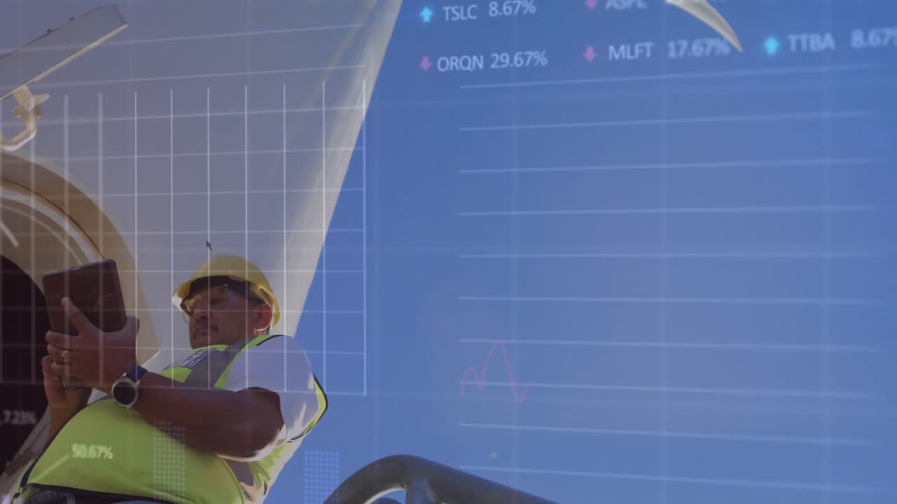 animación de gráficos financieros sobre un hombre biracial con una tableta y una turbina eólica