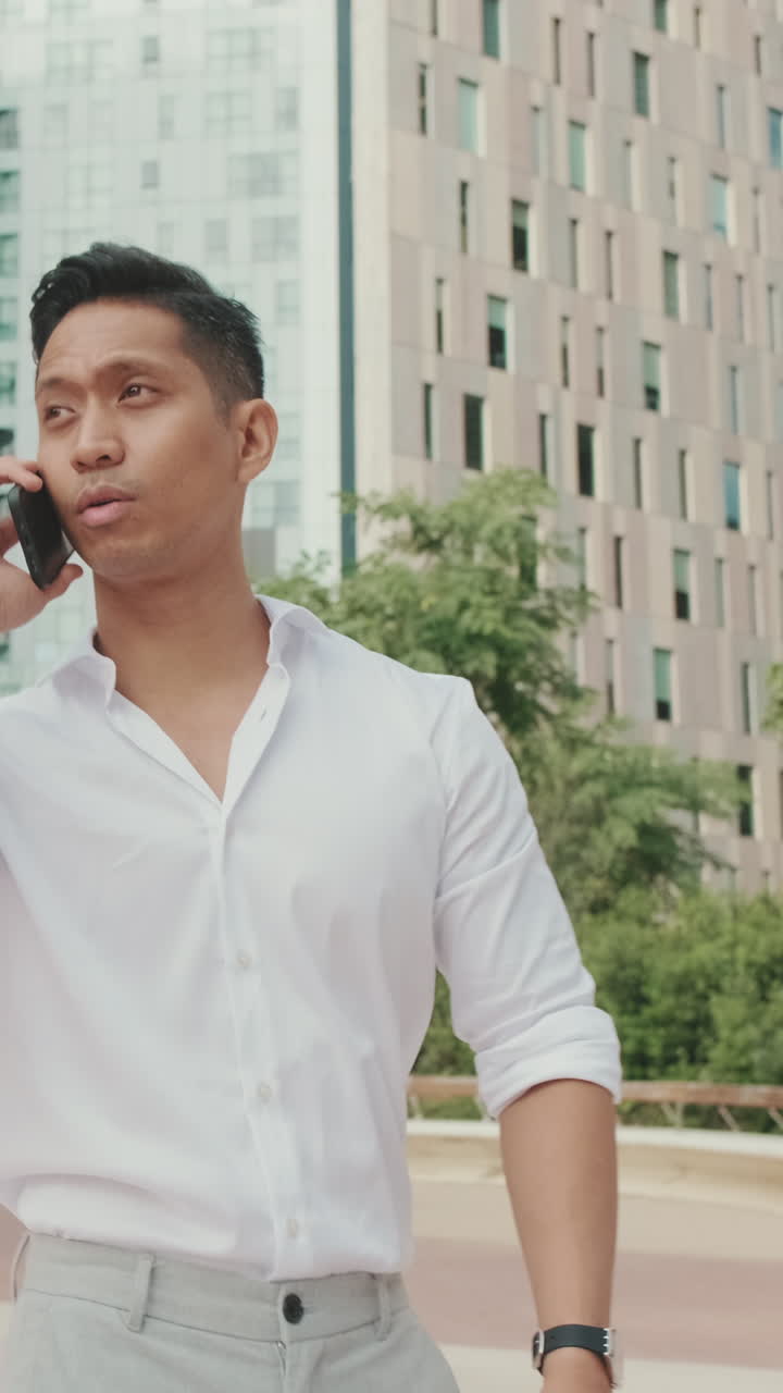 Man talking on cell phone outdoors