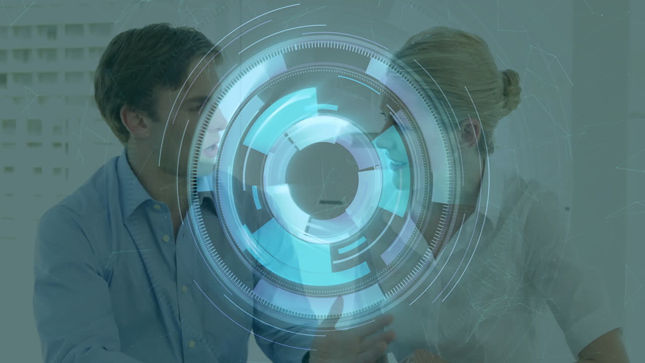 Digital interface animation over two people discussing in modern office setting