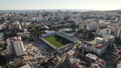 portimao empty municipal stadium and cityscape, portugal