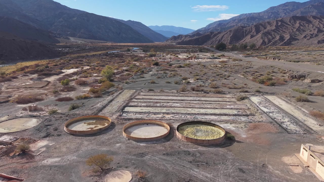 Aerial Dolly Out Revealing Abandoned Aluminum Sulfate Processing Plant Ruins in Calingasta San Juan Argentina