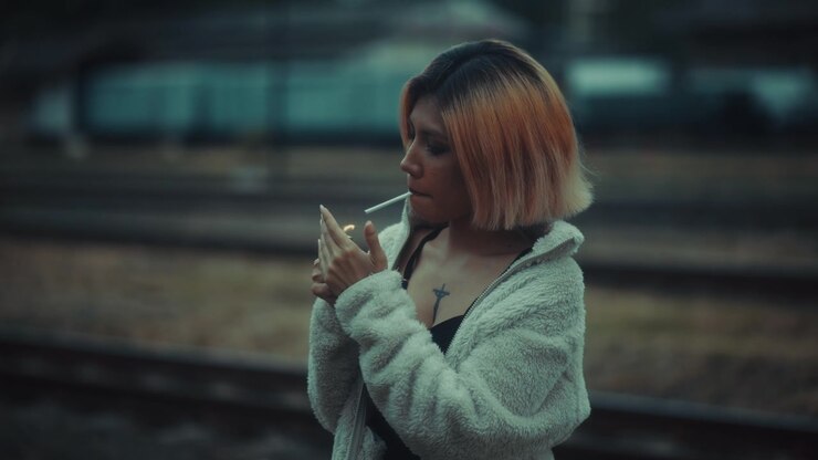beautiful woman smoking cigarettes video Cigarette Extreme Close-up Stock Footage (100% Royalty-free) 12837056 A Woman Smoking a Cigarette