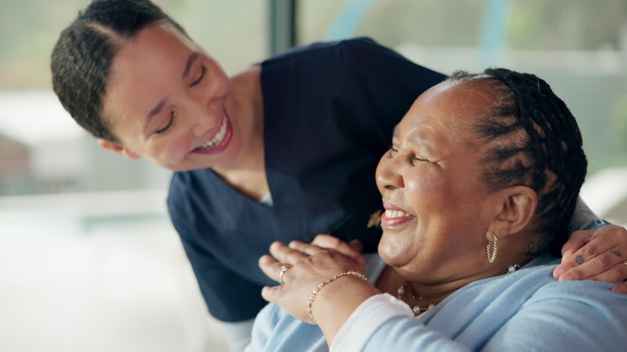 Happy Caregiver and Senior Woman Smiling and Laughing Together