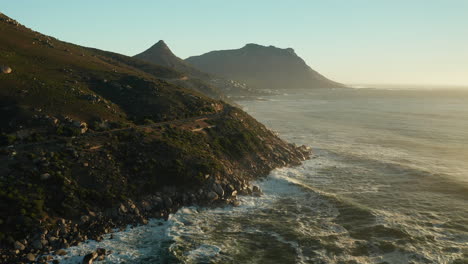 ocean waves crashing in the rocky coast of oudekraal beach and nature reserve in cape town, south africa