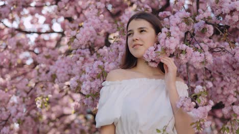 girl surrounded by cherry blossoms