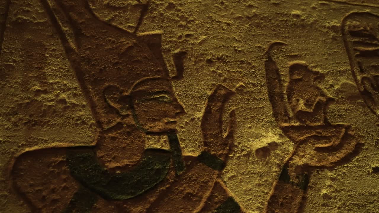 Interior of Ancient Egyptian Abu Simbel temple relief sculpture depicting pharaoh giving offering