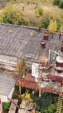 old ruined empty industrial architecture. abandoned destroyed factory territory. vertical video