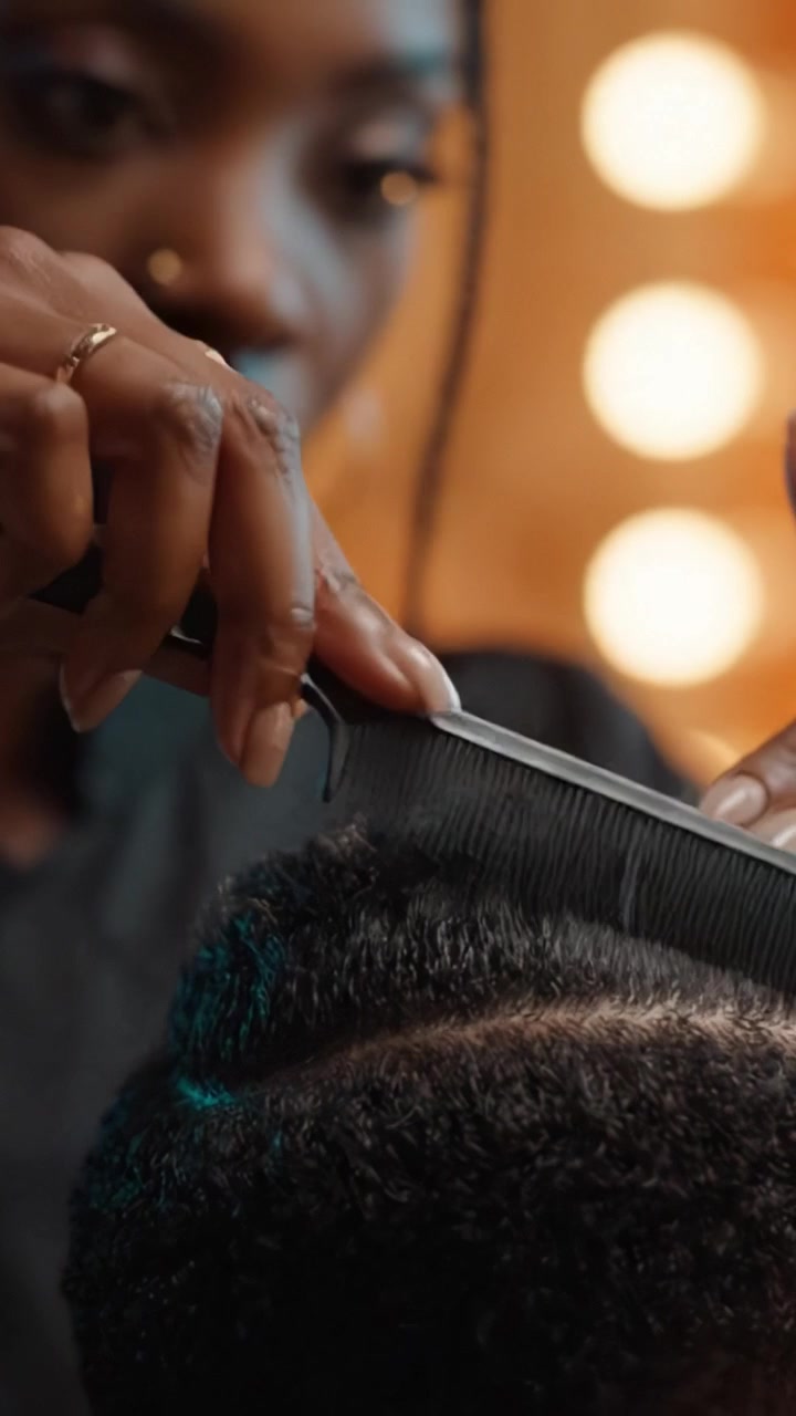 Expert Hair Styling Process Highlighting the Art of Precision and Care in a Salon Setting with Focus on Textured Hair and Professional Techniques