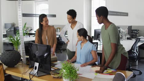 group of diverse businesswomen working together in office