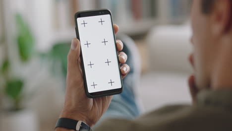 young-man-using-smartphone-having-video-chat-looking-surprised-at-green-screen-enjoying-chatting-on-mobile-phone-chroma-key-display-vertical-orientation-4k-footage