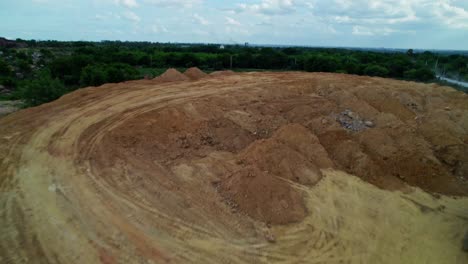sand mining with greenery, sky and clouds at telangana, india. day time, drone shot. 4k