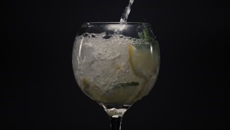 bubbled lemon ice mint cocktail closeup. preparing mojito cocktail concept