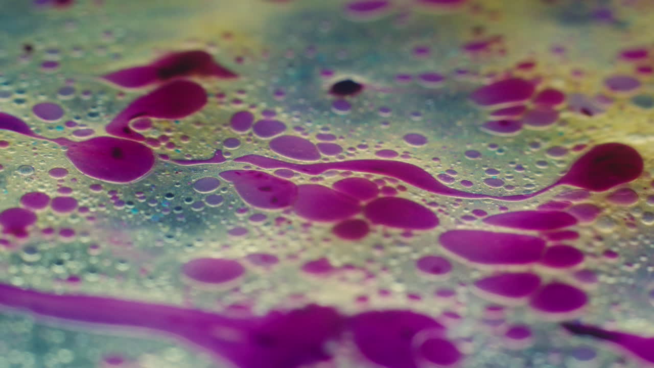 Colourful, organic, liquids macro shots buzzing and flowing