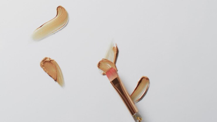 Video of make up brush and smudges with copy space on white background