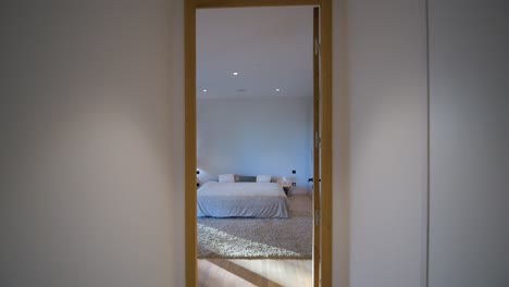 slow motion shot of a bedroom door opening in a villa in st clément de la riviere
